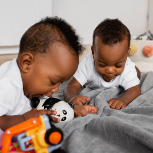 medium-shot-babies-laying-bed-1-Copy.jpg